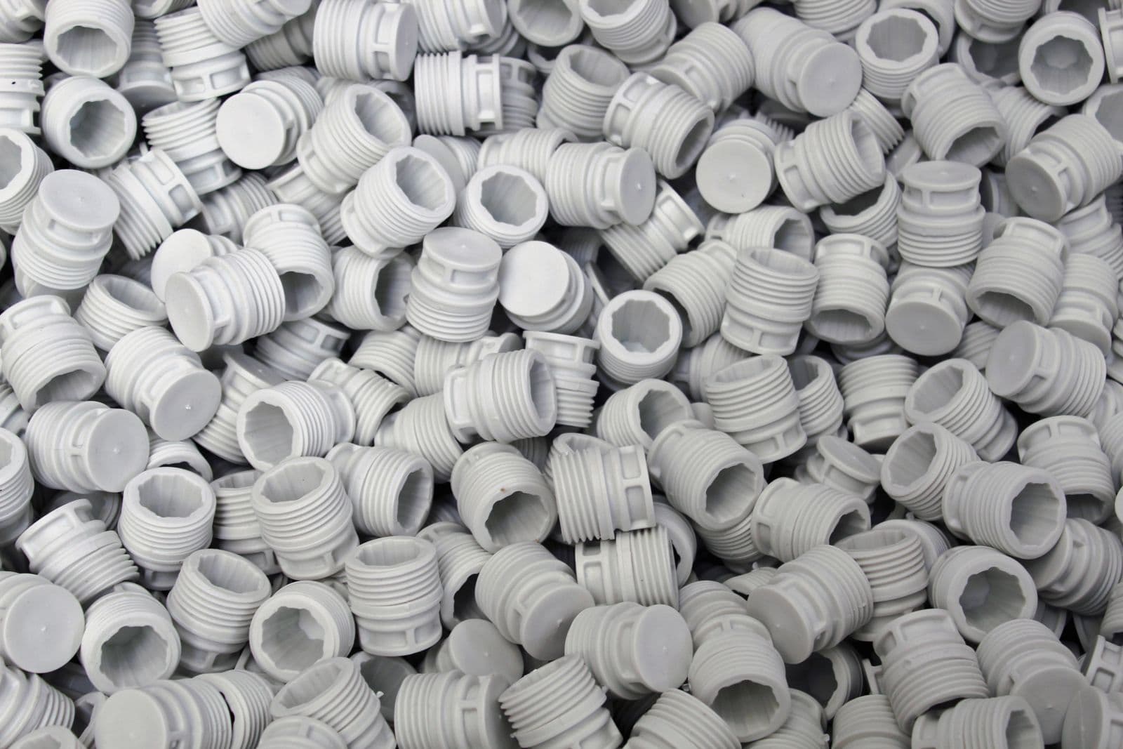 Moulded plastic caps and fittings output