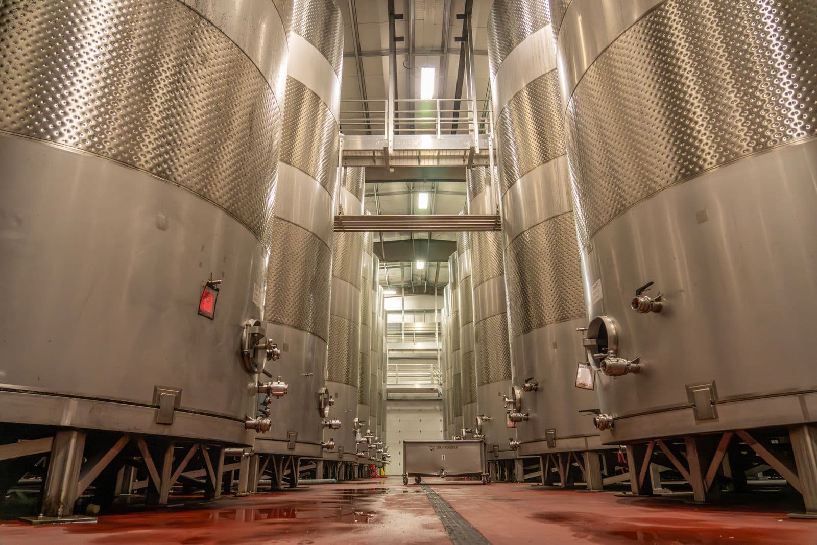 Row of jacketed process reactor tanks