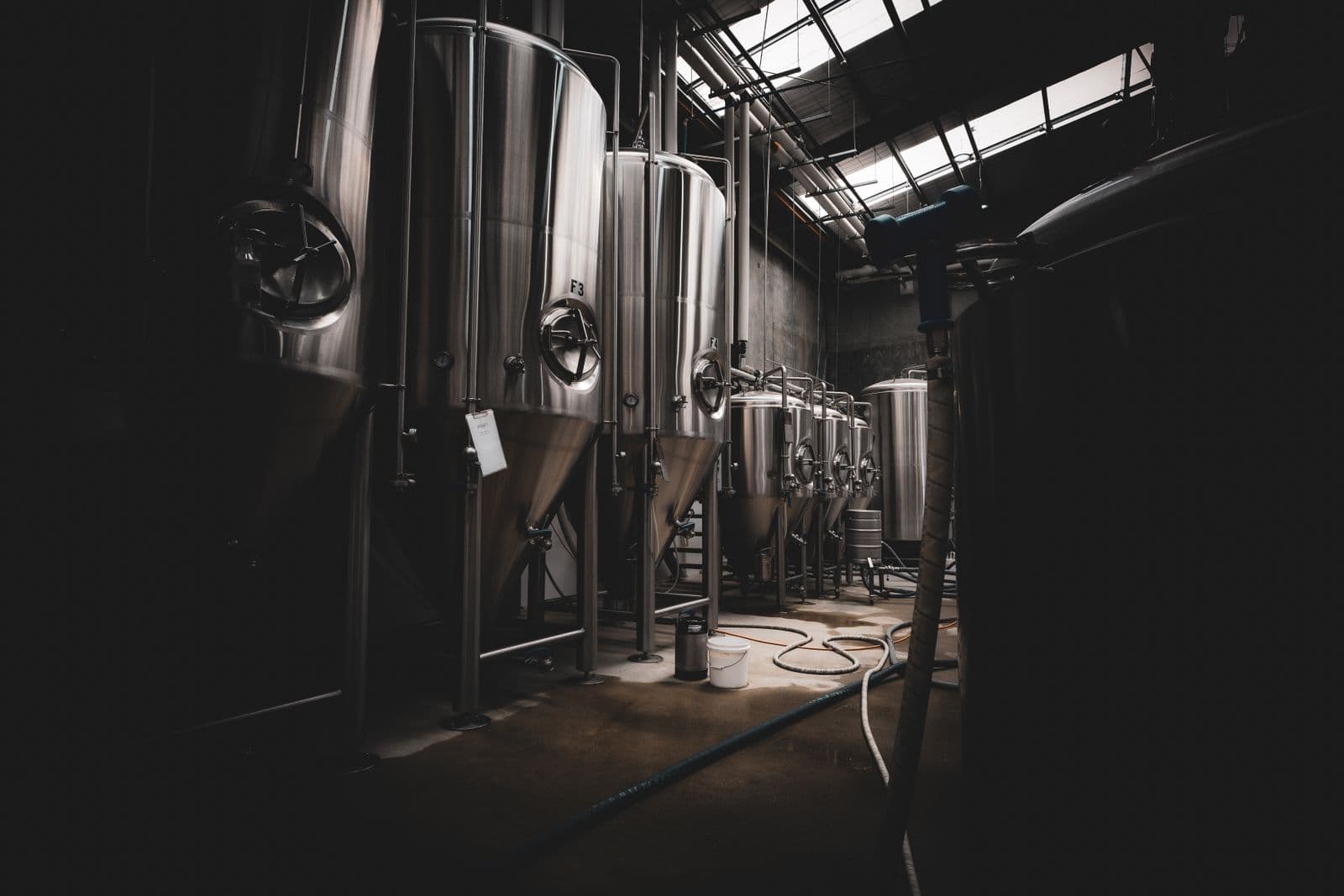 Industrial blending tanks in a process hall